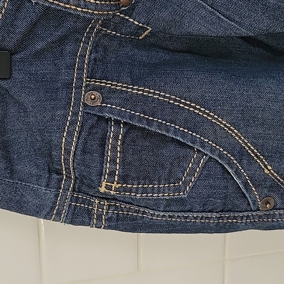 Torrid HI waist pleated dark denim shorts. - Picture 5 of 7